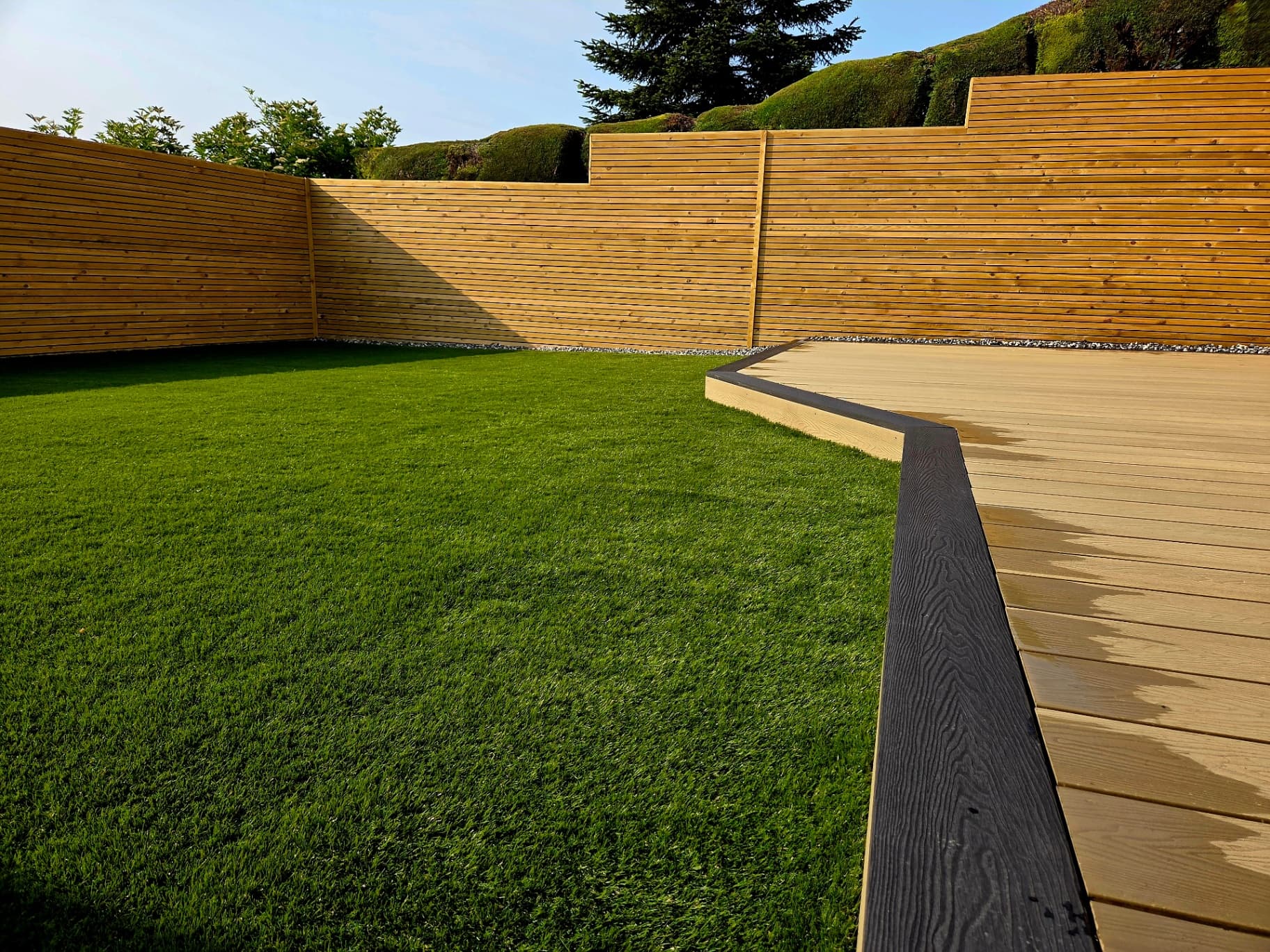 Artificial grass with composite decking border Sheffield