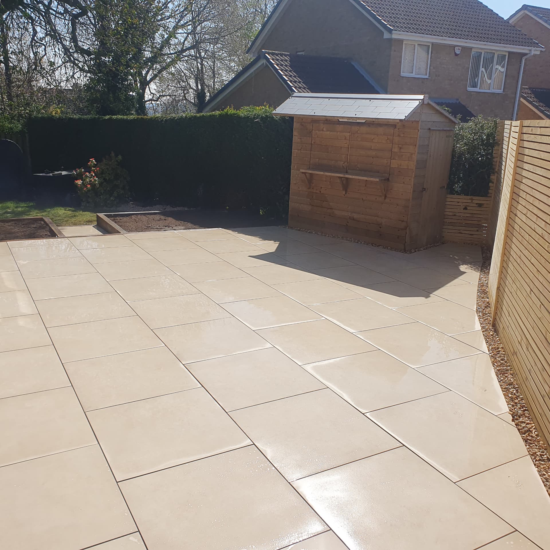 Large paving area with garden shed Sheffield